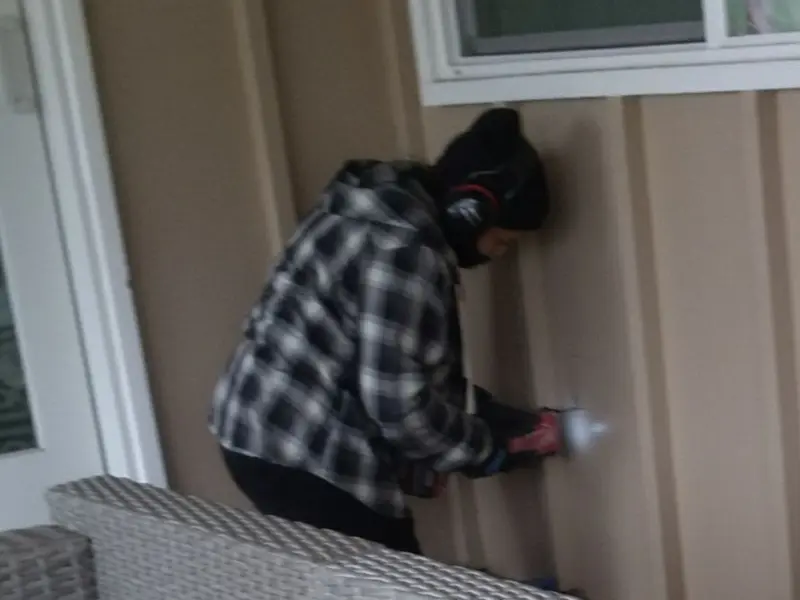 Professional electrician installing an exterior outlet in Lebanon